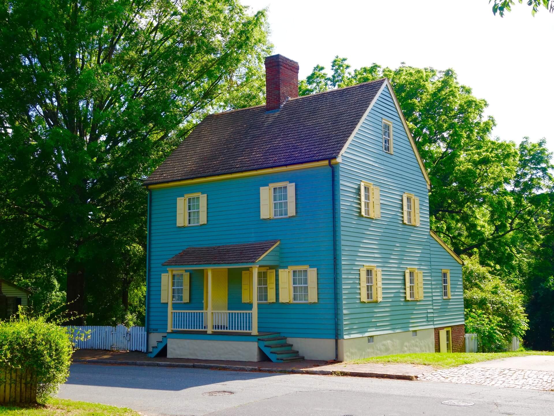 blue and yellow painted house