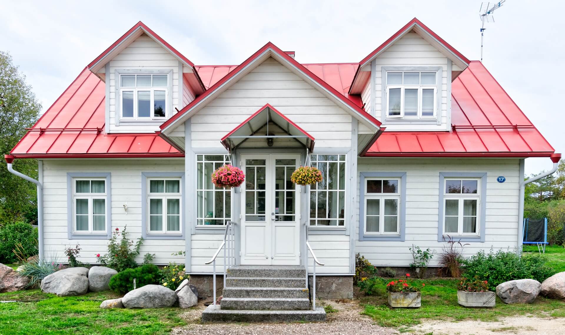 white and red painted house